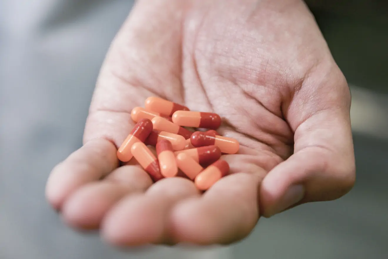 Capsules in the palm of a hand